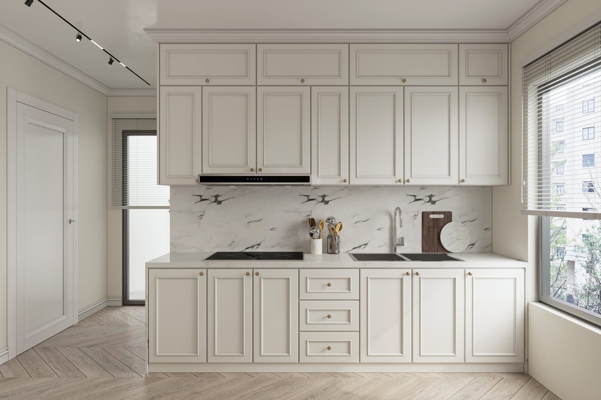 Clean and minimalist kitchen design with white cabinetry and wood floors